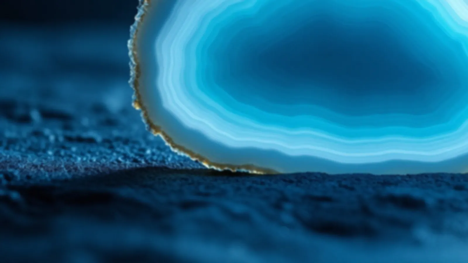 Macro view of a blue banded agate slice backlit on smooth dark stone, the NoteAgate view of loan offers online, $100 – $5,000